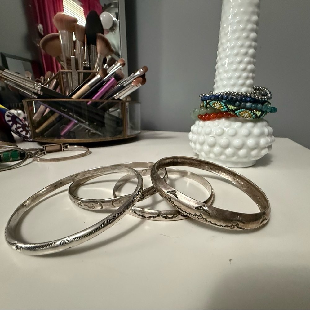 Four Sterling Silver handmade Bangle Bracelets. Will sell as a set or separatel.